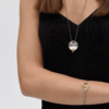 Gray Man Sitting On Gray String Bracelet In A Circle - Image 3