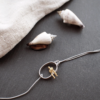 Gray Man Sitting On Gray String Bracelet In A Circle - Image 2